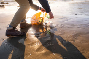 picking up garbage at the beach