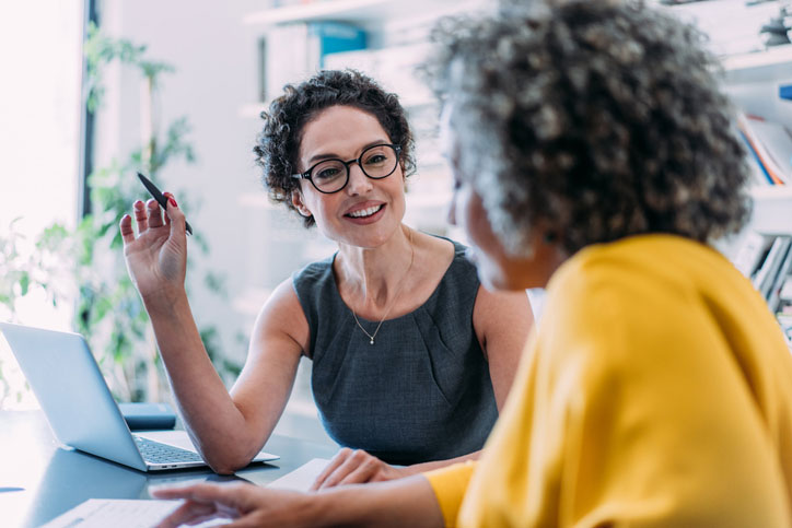 two women discussing project