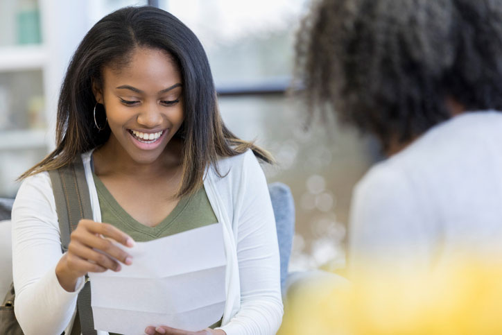 excited student reading college letter