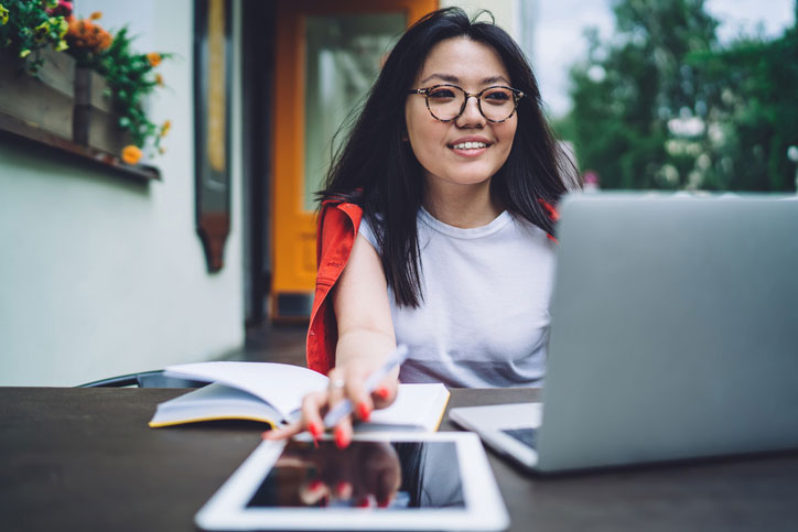 positive woman on computer