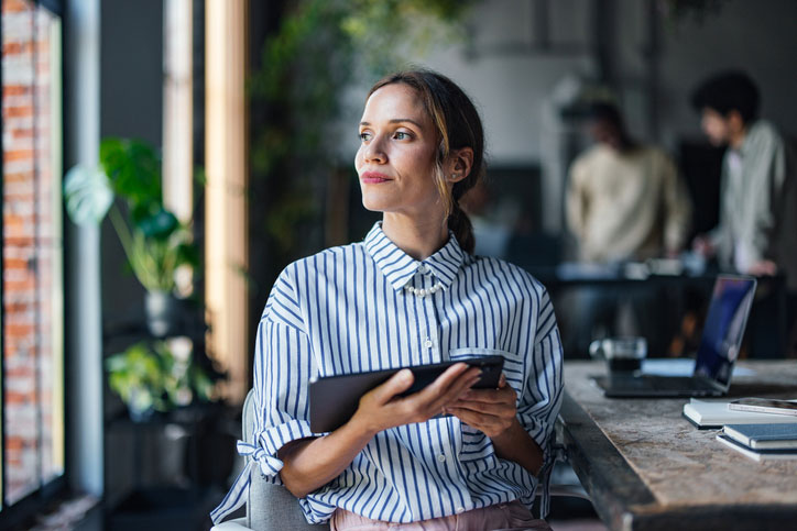 business professional woman on tablet