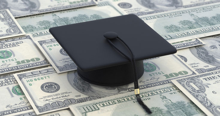 grad cap on rows of cash