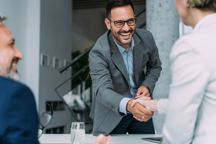 successful partners shaking hands