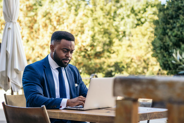 businessman at outdoor table working